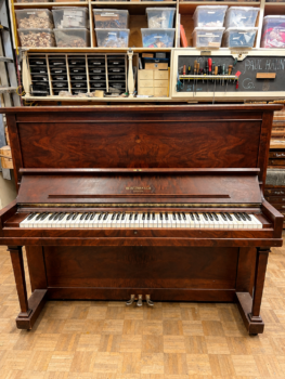 1922 Heintzman Upright Piano Model O in a Walnut Finish.