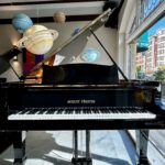 1990 August Förster Grand Piano Model 215 in a Polished Ebony Finish.