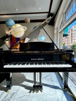 1990 August Förster Grand Piano Model 215 in a Polished Ebony Finish.