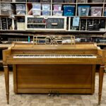 1960 Everett Spinet Upright Piano in a Blonde Finish.