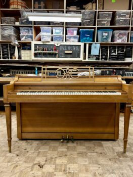 1960 Everett Spinet Upright Piano in a Blonde Finish.