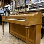 1960 Everett Spinet Upright Piano in a Blonde Finish.