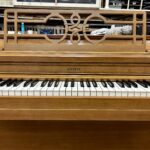 1960 Everett Spinet Upright Piano in a Blonde Finish.