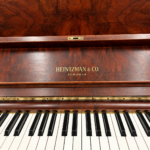 1922 Heintzman Upright Piano Model O in a Walnut Finish.