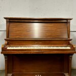 1960 Heintzman Upright Piano Model A-Scale in a Mahogany Finish.