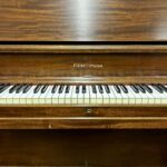 1960 Heintzman Upright Piano Model A-Scale in a Mahogany Finish.