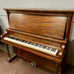 1960 Heintzman Upright Piano Model A-Scale in a Mahogany Finish.