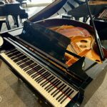 2006 Pearl River Grand Piano Model GP150 in a Polished Ebony Finish