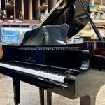 1986 Young Chang Grand Piano Model G157 in a high gloss black.