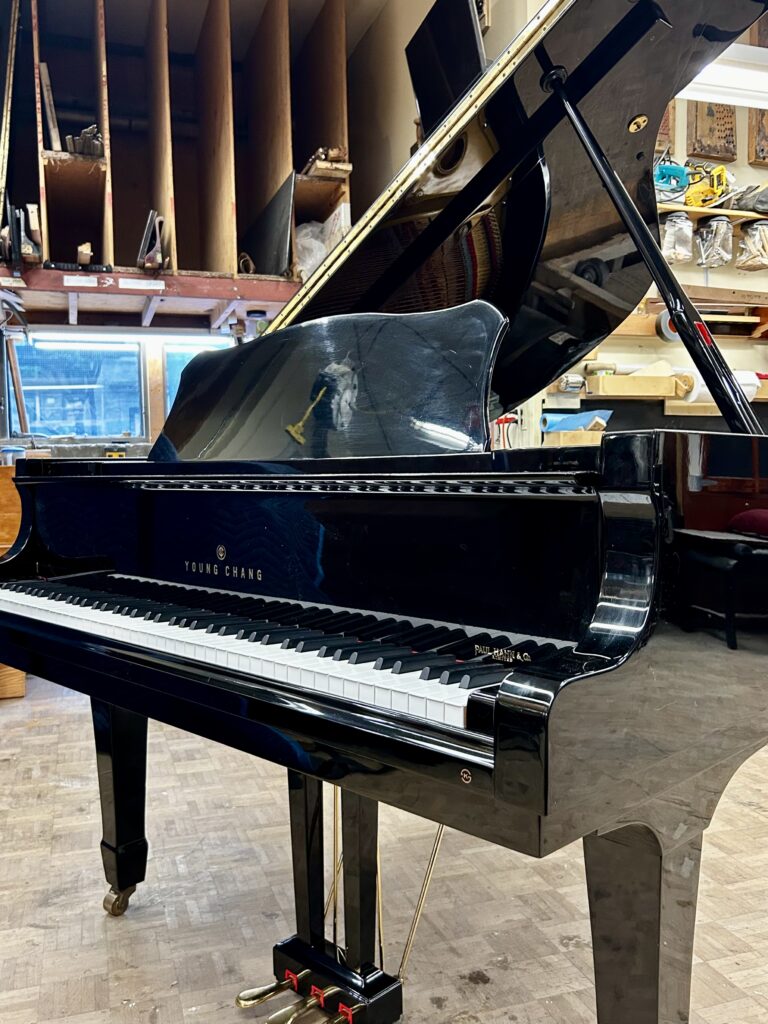 1986 Young Chang Grand Piano Model G157 in a high gloss black.
