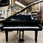 1986 Young Chang Grand Piano Model G157 in a high gloss black.