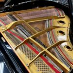 1986 Young Chang Grand Piano Model G157 in a high gloss black.