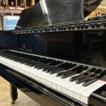 1986 Young Chang Grand Piano Model G157 in a high gloss black.